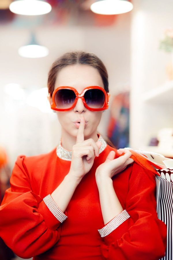 Cool mysterious girl with shopping bags undercover